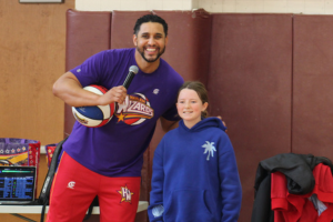  Wizard player posing with Middle School student